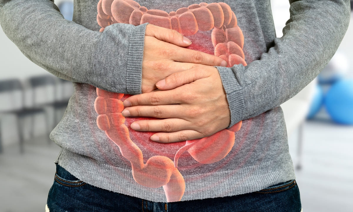 Hands touching on stomach
